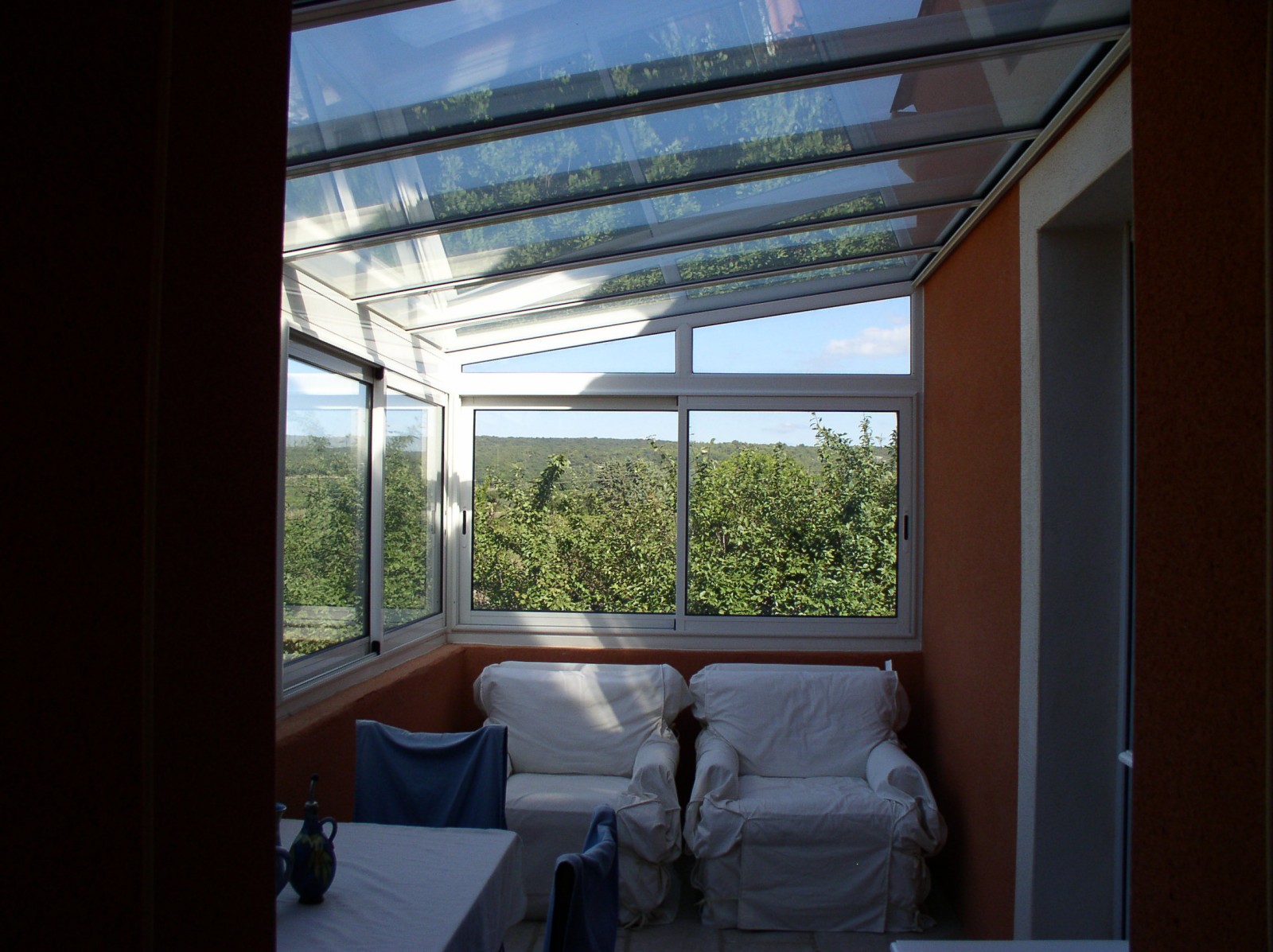 Menuisier à Uzès pour fabriquer une véranda vitrée en alu