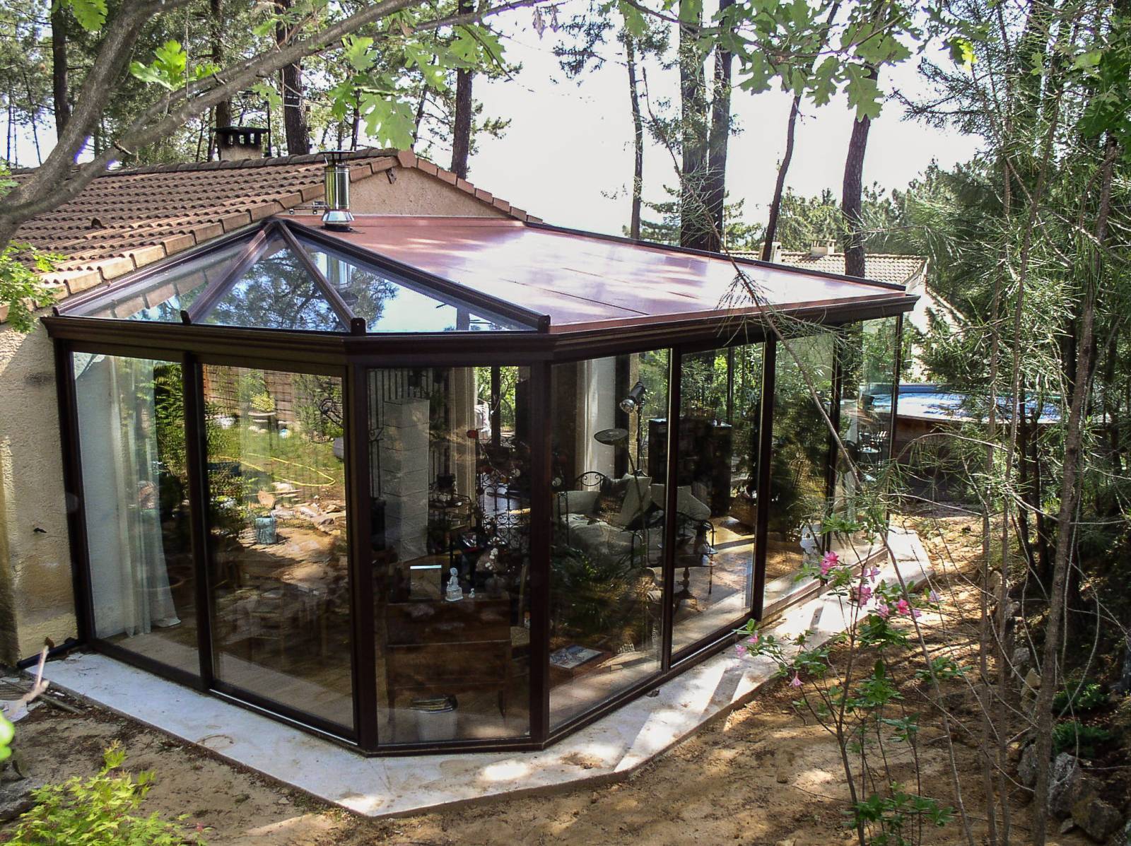 Construction de véranda avec toiture mixte dans le Gard